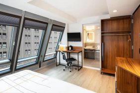 Guest room in La Quinta Times Square South, with workspace and ensuite bathroom.