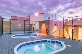 Relaxing rooftop hot tubs at Hotel Clique Calgary Airport.