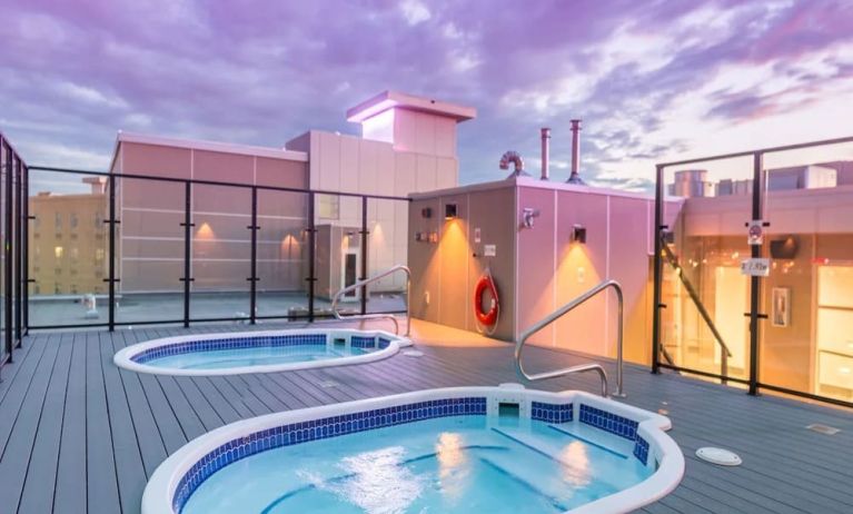 Relaxing rooftop hot tubs at Hotel Clique Calgary Airport.