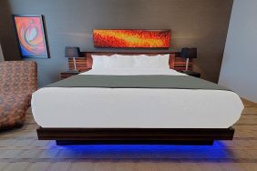 Luxurious and funky style delux king bed at Hotel Clique Calgary Airport.