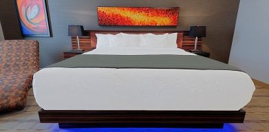 Luxurious and funky style delux king bed at Hotel Clique Calgary Airport.