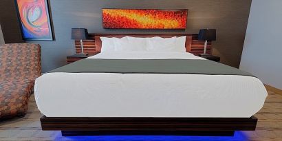 Luxurious and funky style delux king bed at Hotel Clique Calgary Airport.