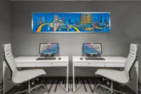 Dedicated business center with PC, internet, and printer at Hotel Clique Calgary Airport.