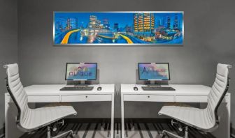 Dedicated business center with PC, internet, and printer at Hotel Clique Calgary Airport.