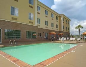 Large outdoor pool at Comfort Suites Alexandria, LA.