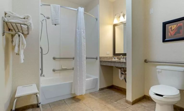 Guest bathroom with bath and shower combo at Comfort Suites Alexandria, LA.