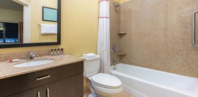 Private guest bathroom at Hawthorn Suites By Wyndham Longview.