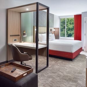 Spacious king room with TV and business desk at SpringHill Suites Atlanta Northwest.