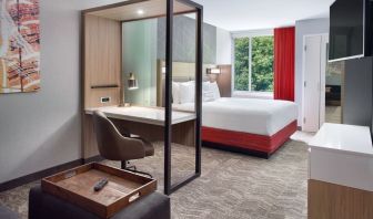 Spacious king room with TV and business desk at SpringHill Suites Atlanta Northwest.