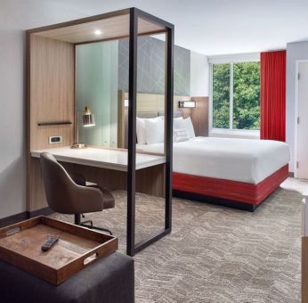 Spacious king room with TV and business desk at SpringHill Suites Atlanta Northwest.