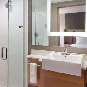 Private guest bathroom with shower at SpringHill Suites Atlanta Northwest.