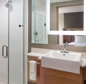 Private guest bathroom with shower at SpringHill Suites Atlanta Northwest.