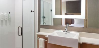 Private guest bathroom with shower at SpringHill Suites Atlanta Northwest.