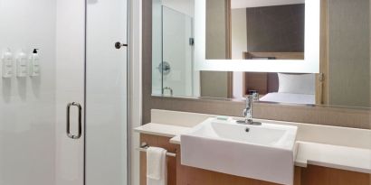 Private guest bathroom with shower at SpringHill Suites Atlanta Northwest.