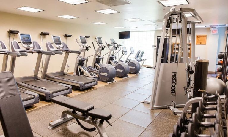 Fitness center with treadmills at Embassy Suites By Hilton West Palm Beach Central.