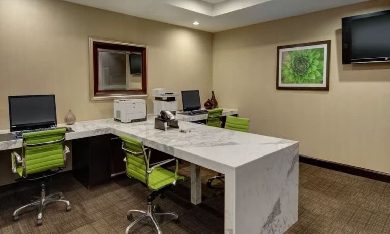 Business center wwith PC and internet at Embassy Suites By Hilton West Palm Beach Central.