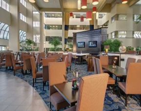Dining and coworking space at Embassy Suites By Hilton West Palm Beach Central.