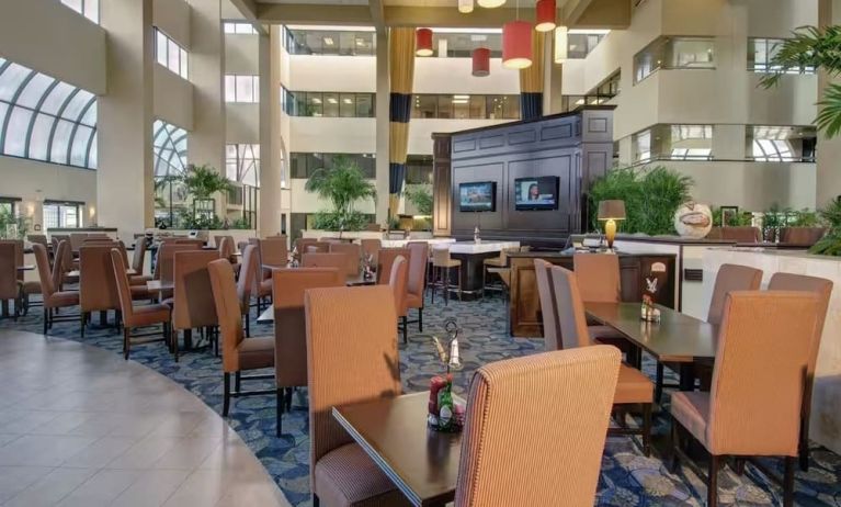 Dining and coworking space at Embassy Suites By Hilton West Palm Beach Central.