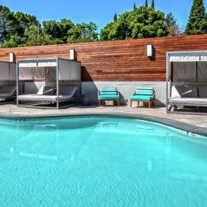 Relaxing pool area with cabanas at Hampton Inn Vallejo.