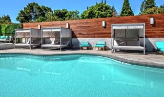 Relaxing pool area with cabanas at Hampton Inn Vallejo.