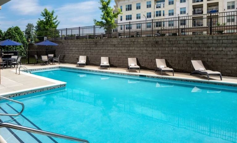 Large outdoor pool at Hampton Inn & Suites Charlotte/Ballantyne.