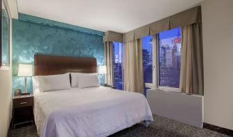 King bedroom with city views at Hilton Garden Inn New York/West 35th Street.