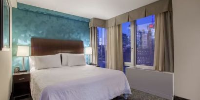 King bedroom with city views at Hilton Garden Inn New York/West 35th Street.