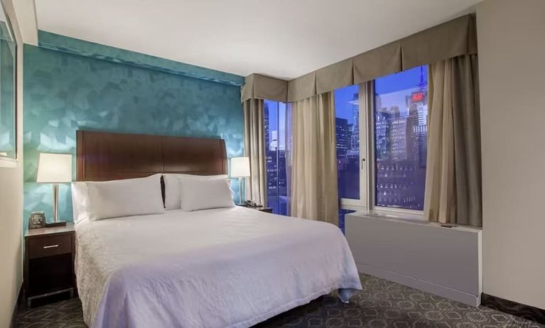 King bedroom with city views at Hilton Garden Inn New York/West 35th Street.