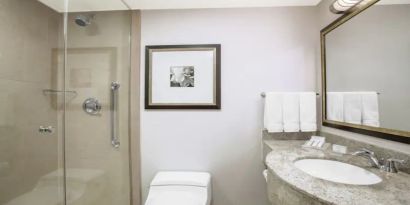 Private guest bathroom with shower at Hilton Garden Inn New York/West 35th Street.