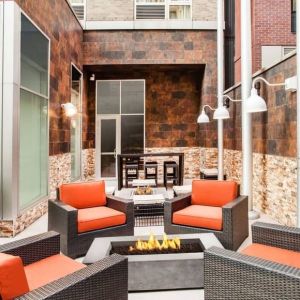 Cozy coworking space with fire pit at Hilton Garden Inn New York/West 35th Street.