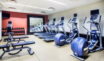 The hotel fitness center, with weights, benches, and exercise machines.