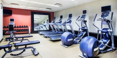 The hotel fitness center, with weights, benches, and exercise machines.