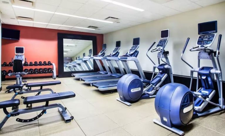 The hotel fitness center, with weights, benches, and exercise machines.