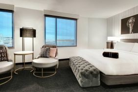 Spacious king bed with natural light at The Rose Hotel Chicago O’Hare, Tapestry Collection By Hilton.