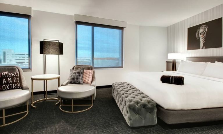 Spacious king bed with natural light at The Rose Hotel Chicago O’Hare, Tapestry Collection By Hilton.