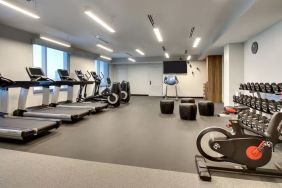 Well equipped fitness center at The Rose Hotel Chicago O’Hare, Tapestry Collection By Hilton.