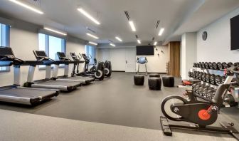 Well equipped fitness center at The Rose Hotel Chicago O’Hare, Tapestry Collection By Hilton.