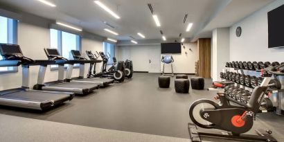 Well equipped fitness center at The Rose Hotel Chicago O’Hare, Tapestry Collection By Hilton.