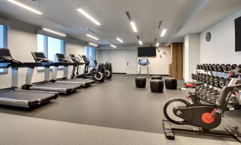 Well equipped fitness center at The Rose Hotel Chicago O’Hare, Tapestry Collection By Hilton.