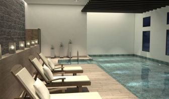 Stunning indoor pool with sun beds at Doubletree By Hilton Toluca.