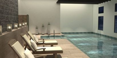 Stunning indoor pool with sun beds at Doubletree By Hilton Toluca.