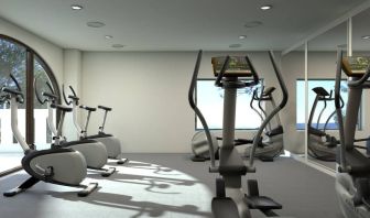 Well equipped fitness center with stationary bikes at Doubletree By Hilton Toluca.