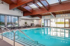 Lovely indoor pool with deck chairs at DoubleTree By Hilton Washington DC North/Gaithersburg.