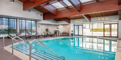 Lovely indoor pool with deck chairs at DoubleTree By Hilton Washington DC North/Gaithersburg.