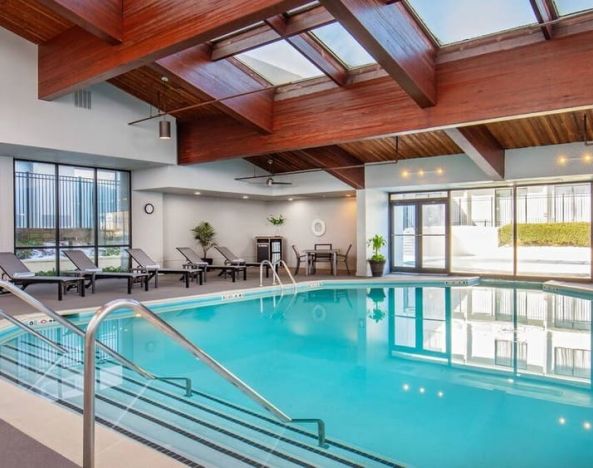 Lovely indoor pool with deck chairs at DoubleTree By Hilton Washington DC North/Gaithersburg.