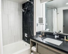 Private guest bathroom with shower at DoubleTree By Hilton Washington DC North/Gaithersburg.