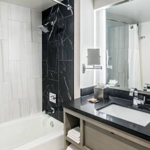 Private guest bathroom with shower at DoubleTree By Hilton Washington DC North/Gaithersburg.