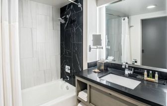 Private guest bathroom with shower at DoubleTree By Hilton Washington DC North/Gaithersburg.