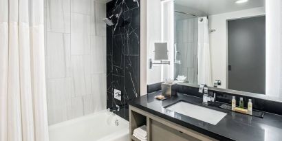 Private guest bathroom with shower at DoubleTree By Hilton Washington DC North/Gaithersburg.