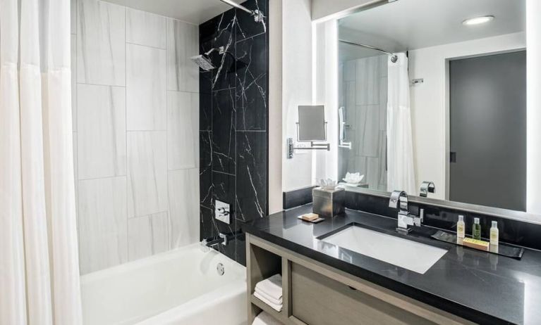 Private guest bathroom with shower at DoubleTree By Hilton Washington DC North/Gaithersburg.